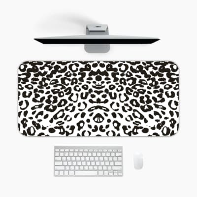 Infidu White Leopard Print Desk Pad features black spots on a white background, creating a classic and stylish leopard print design A desk pad under the computer