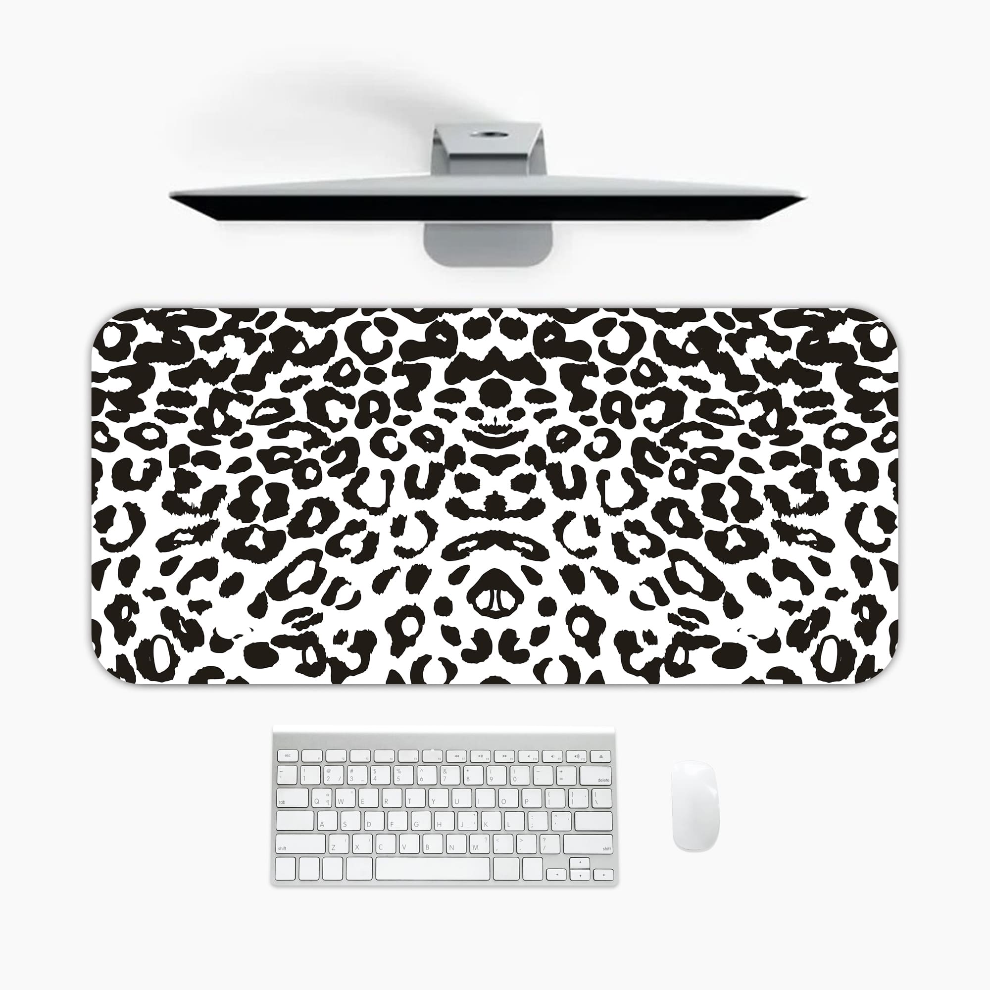 Infidu White Leopard Print Desk Pad features black spots on a white background, creating a classic and stylish leopard print design A desk pad under the computer