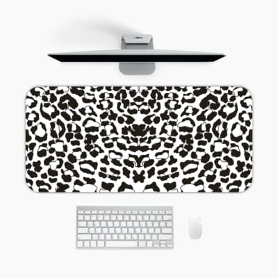 Infidu White Desk Pad with black spotted leopard print design on a white background, adding a chic touch. A desk pad under the computer