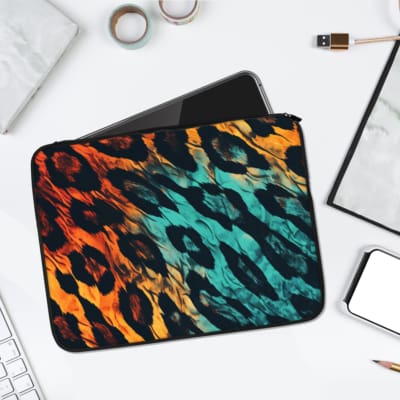 Bold leopard print laptop sleeve with orange, yellow, and blue gradient design, featuring a secure zip closure for stylish laptop protection. laptop sleeve kept on a plain white background