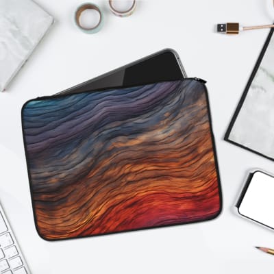 Gradient Waves Laptop Sleeve with flowing abstract design in blue, purple, orange, and pink tones, offering stylish and secure protection. laptop sleeve kept on a plain white background
