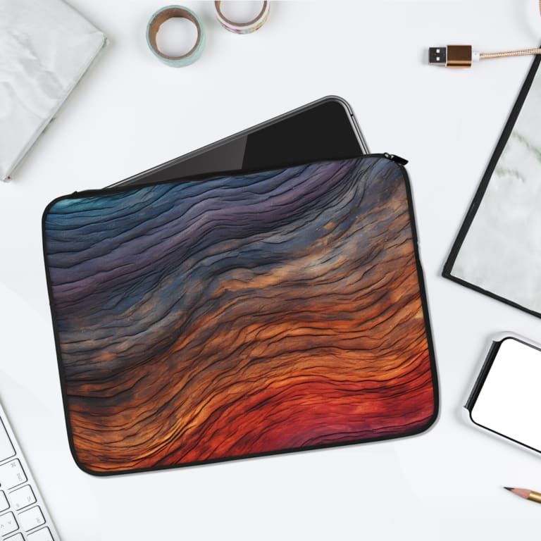 Gradient Waves Laptop Sleeve with flowing abstract design in blue, purple, orange, and pink tones, offering stylish and secure protection. laptop sleeve kept on a plain white background