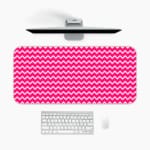 Infidu Vibrant Pink and White Striped Desk Mat with dynamic alternating pink and white stripes. A desk pad under the computer