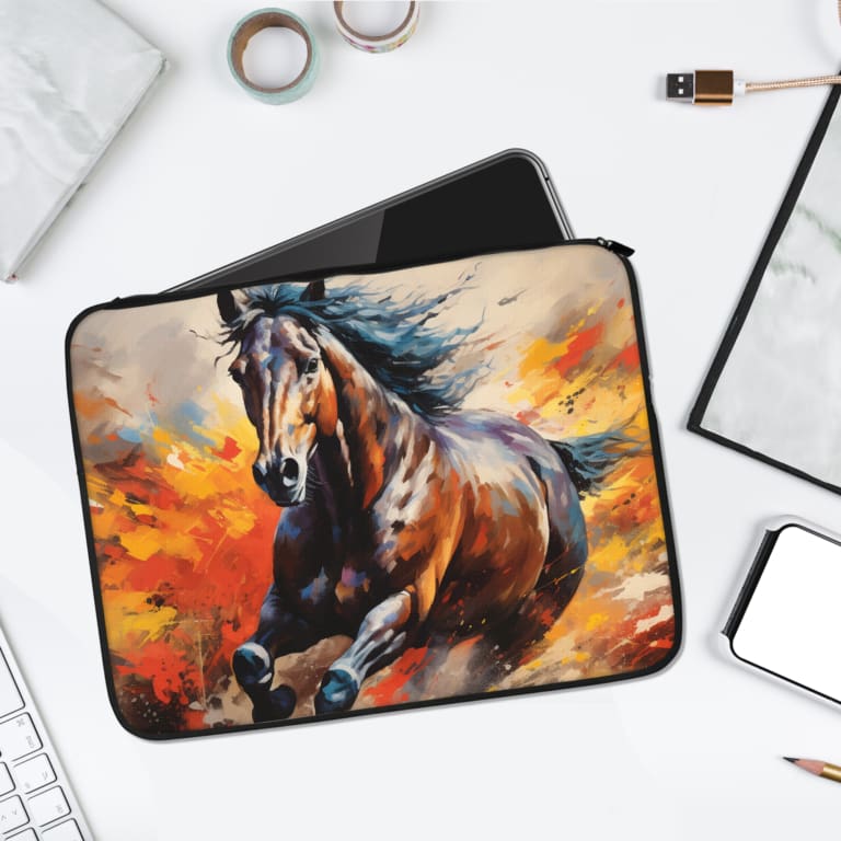 Laptop sleeve featuring a galloping horse with fiery background, made with durable fabric and secure zip closure for laptop protection. laptop sleeve kept on a plain white background
