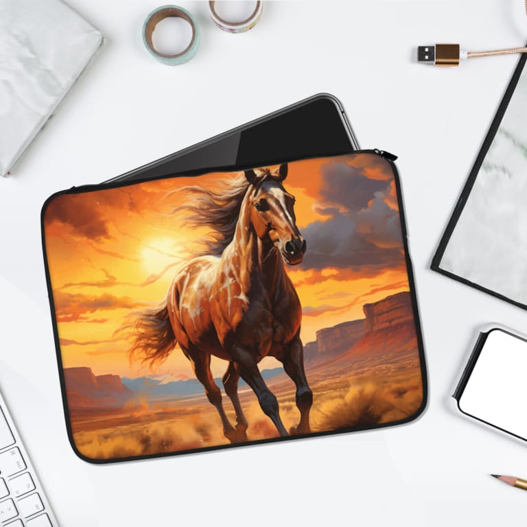Infidu Galloping Horse Laptop Sleeve with sunset background and vibrant colors of orange, yellow, and brown. laptop sleeve kept on a plain white background