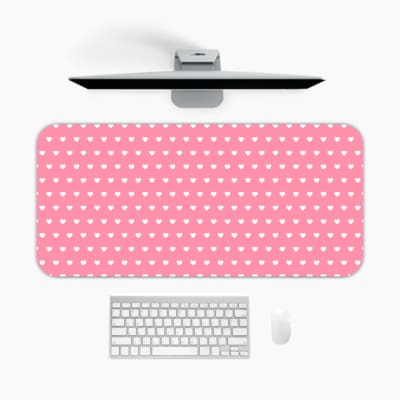 Light pink and white polka dot desk pad with a classic pattern design. A desk pad under the computer