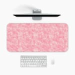 Infidu Pink Geometric Desk Mat with subtle geometric patterns on a pink background. A desk pad under the computer