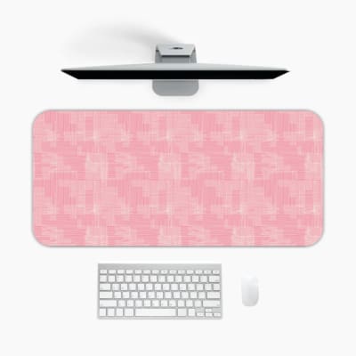 Infidu Pink Geometric Desk Mat with subtle geometric patterns on a pink background. A desk pad under the computer