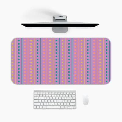 Infidu desk pad with a pink background and vertical columns of blue and yellow dots. A desk pad under the computer