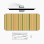 Infidu desk pad with vertical stripes in yellow, green, and light purple. A desk pad under the computer