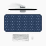 Blue and white polka dot desk pad with a classic pattern design. A desk pad under the computer
