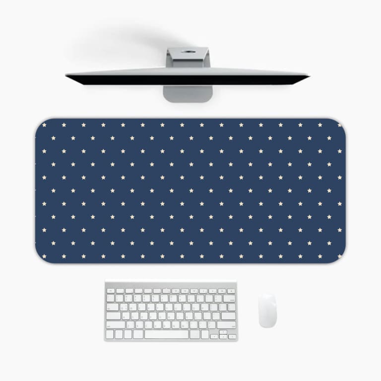 Blue and white polka dot desk pad with a classic pattern design. A desk pad under the computer