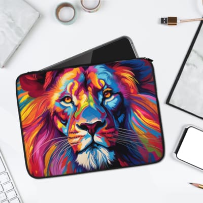 Colorful abstract lion design laptop sleeve in blue, pink, purple, yellow, and orange with secure zip closure. laptop sleeve kept on a plain white background