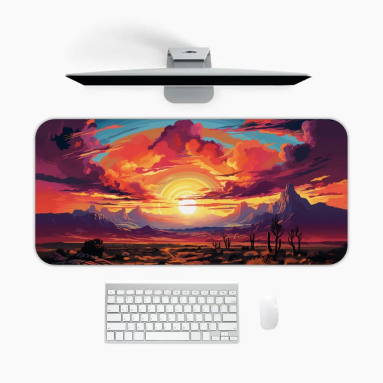 Infidu Vivid Sunset Over Desert Landscape Desk Mat with vibrant sunset colors and dark desert silhouettes. A desk pad under the computer