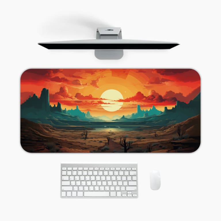 A vibrant sunset desk pad with silhouetted mountains and desert terrain. A desk pad under the computer