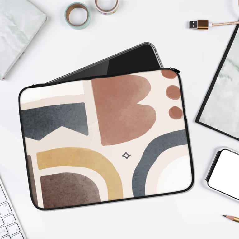 Infidu Contemporary Abstract Earth-Toned Laptop Sleeve with beige, cream, brown, and muted blue tones in geometric and organic shapes. laptop sleeve kept on a plain white background