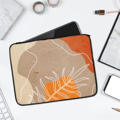Abstract earthy-toned laptop sleeve with botanical art in orange, beige, and light brown, featuring white-line botanical illustrations. laptop sleeve kept on a plain white background