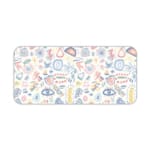 Desk pad with whimsical symbols including eyes, geometric shapes, and abstract designs in light blue, pink, and orange. Desk Pad kept on a plain white background