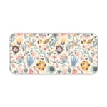 Infidu desk pad with soft pastel floral design on a light pink background, featuring delicate light blue, pink, and beige flowers. Desk Pad kept on a plain white background
