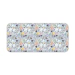 Desk pad with colorful abstract shapes in orange, black, white, and blue on a light blue background. Desk Pad kept on a plain white background