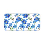 Desk pad with blue flowers, yellow centers, and green leaves on a white background. Desk Pad kept on a plain white background