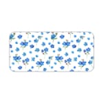 Desk pad with small blue flowers and dark green leaves on a white background. Desk Pad kept on a plain white background