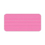 Pink desk pad with a pattern of small, evenly spaced triangles. Desk Pad kept on a plain white background