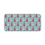 Infidu desk pad with red Christmas trees and blue teacups on a light blue background, creating a festive and cheerful design. Desk Pad kept on a plain white background