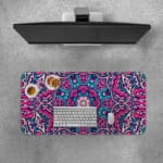 Infidu Colorful Mandala Desk Pad featuring a vivid mandala pattern with symmetrical shapes in pink, purple, and blue tones. Desk Pad with Keyboard and Mouse on top of the desk pad