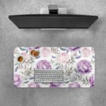 Infidu Purple Floral Design Desk Pad with large purple flowers and soft green leaves on a light, neutral background. Desk Pad with Keyboard and Mouse on top of the desk pad