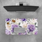 Infidu desk pad with colorful floral design on white background. Features large yellow and purple flowers with green and grayish leaves. Desk Pad with Keyboard and Mouse on top of the desk pad