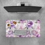 Infidu Floral Desk Pad featuring purple and light pink flowers with green and grayish leaves on a light white background.Desk Pad with Keyboard and Mouse on top of the desk pad
