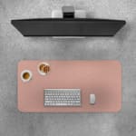 Infidu Light Pink Desk Pad with a plain, soft pink design Desk Pad with Keyboard and Mouse on top of the desk pad