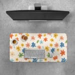 Infidu Colorful Floral Design Desk Pad with vibrant flowers in yellow, pink, blue, orange, and green on a light pink background. Desk Pad with Keyboard and Mouse on top of the desk pad