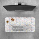 Infidu Playful Abstract Shapes Desk Pad featuring colorful eyes, symbols, and shapes on a light background. Desk Pad with Keyboard and Mouse on top of the desk pad