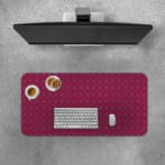 Pink desk pad with a pattern of small dots. Desk Pad with Keyboard and Mouse on top of the desk pad