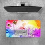 Infidu Vibrant Watercolor Design Desk Pad with abstract, colorful swirls of pink, orange, yellow, blue, and purple. Desk Pad with Keyboard and Mouse on top of the desk pad