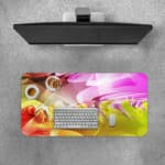 Infidu Colorful Abstract Wavy Lines Desk Pad featuring vibrant, flowing lines in pink, purple, yellow, orange, and green. Desk Pad with Keyboard and Mouse on top of the desk pad