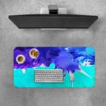 Infidu Abstract Desk Pad with blue, purple, and green colors, featuring sharp and flowing lines on a light background. Desk Pad with Keyboard and Mouse on top of the desk pad