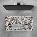 Infidu Black Leopard Print Desk Pad features a bold black leopard print pattern on a white background, offering a modern and stylish look. Desk Pad with Keyboard and Mouse on top of the desk pad