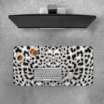 Infidu White Desk Pad with black leopard print spots on a white background, featuring a bold and untamed animal print design. Desk Pad with Keyboard and Mouse on top of the desk pad