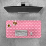 Light pink and white polka dot desk pad with a classic pattern design. Desk Pad with Keyboard and Mouse on top of the desk pad