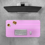 Pink and white striped desk pad with horizontal lines on a white background. Desk Pad with Keyboard and Mouse on top of the desk pad