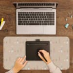 Infidu Soft Brown Desk Pad with White Dots Design. Soft brown background with white dots scattered across. A writing pad on top of the desk pad