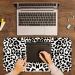 Infidu White Desk Pad with black spotted leopard print design on a white background, adding a chic touch. A writing pad on top of the desk pad