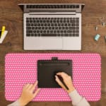 Infidu Pink Desk Mat with White Polka Dots A writing pad on top of the desk pad