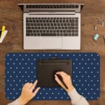 Blue and white polka dot desk pad with a classic pattern design. A writing pad on top of the desk pad