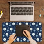 Infidu Dark Blue Desk Pad with white circles, light blue stripes, and snowflake pattern. A writing pad on top of the desk pad