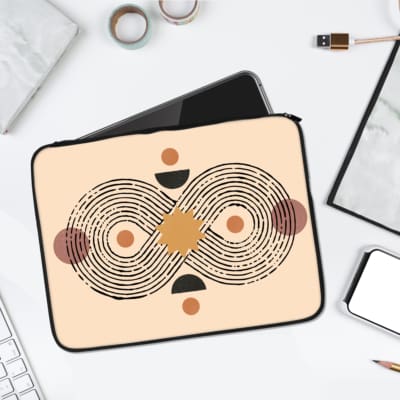 Laptop sleeve featuring a minimalist infinity-style design with concentric black lines and circular shapes in shades of orange, brown, and black. laptop sleeve kept on a plain white background