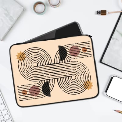 Minimalist curved lines abstract laptop sleeve with pink, black, and orange accents for stylish laptop protection. laptop sleeve kept on a plain white background